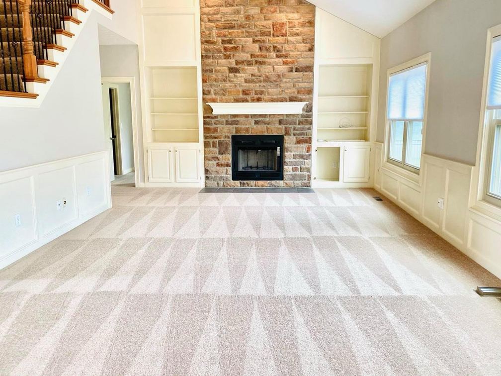 Living room with freshly cleaned carpet showing vacuum lines