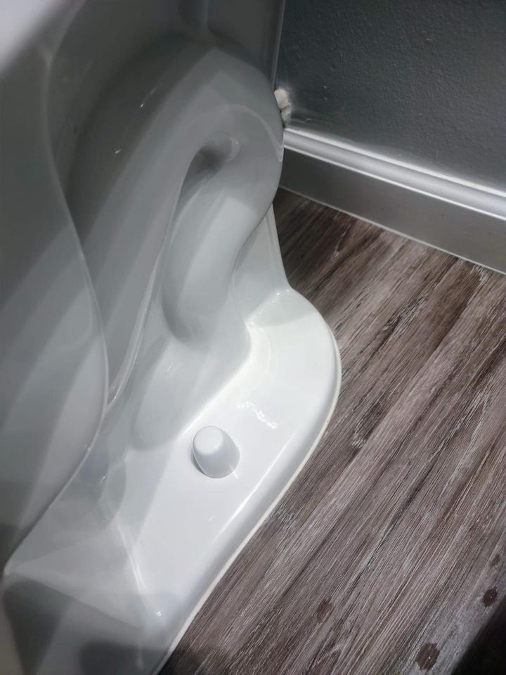 Detailed cleaning around toilet base, corners and crevices