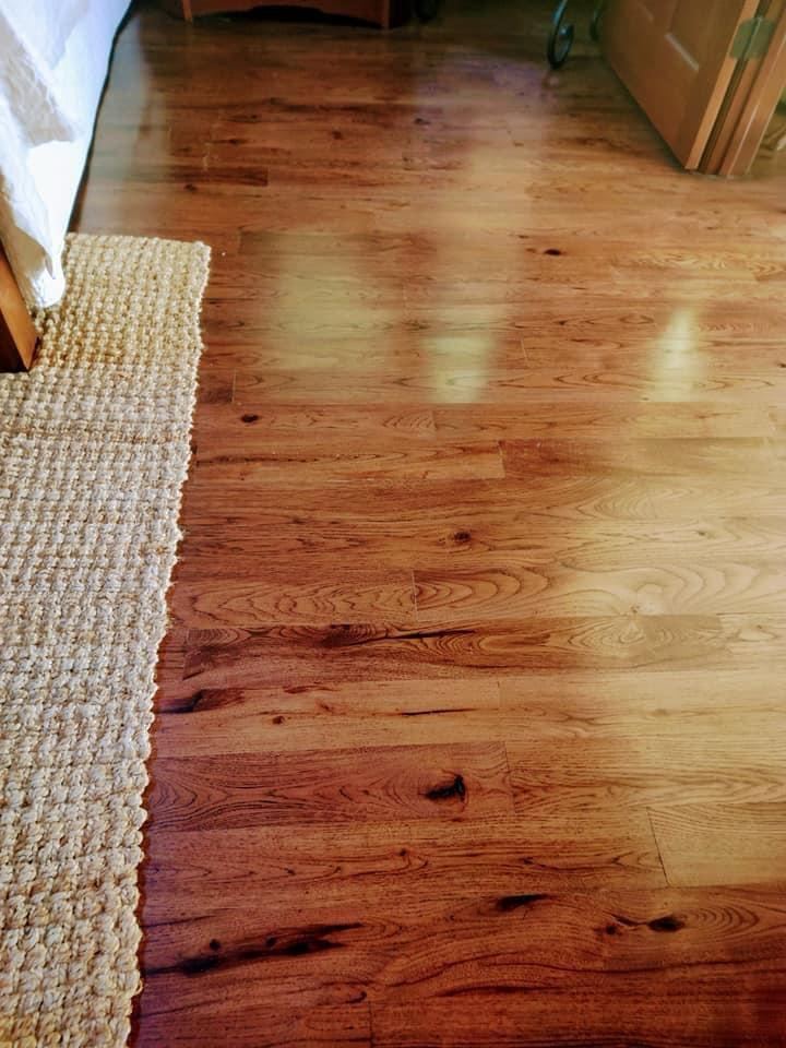 Hardwood floor gleaming after professional cleaning