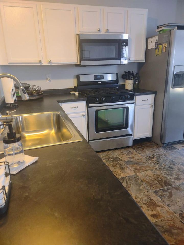 Kitchen counters and stove polished and sanitized