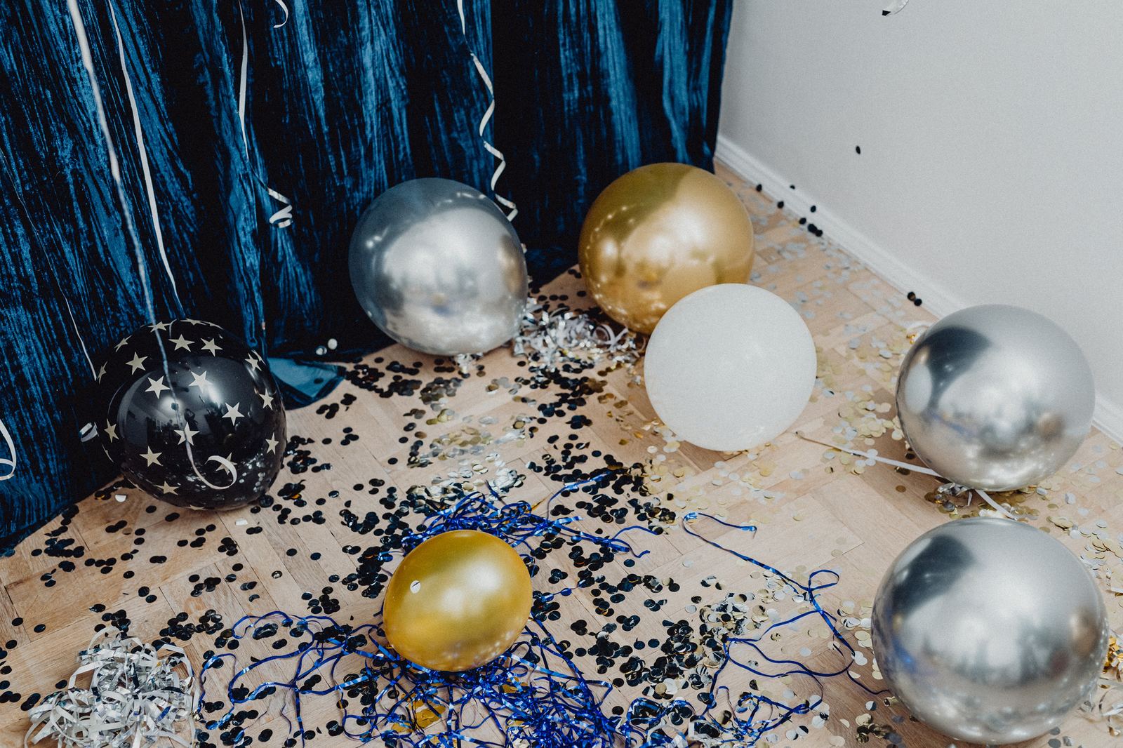 Event space with balloons and confetti before cleanup